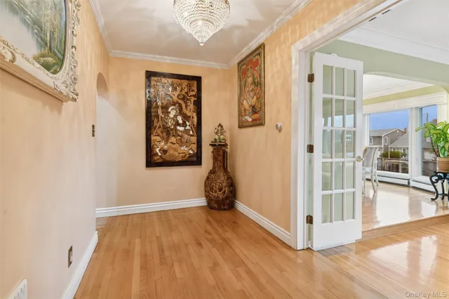 a view of a room with wooden floor and windows