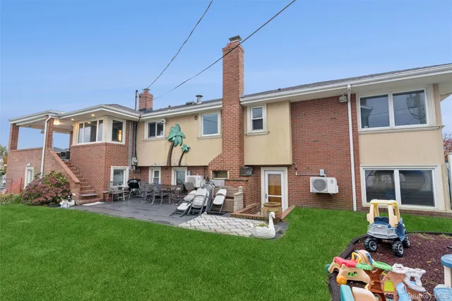 a view of a backyard with sitting area
