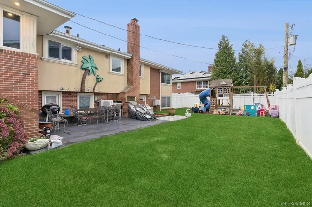 a view of a house with a yard porch and sitting area