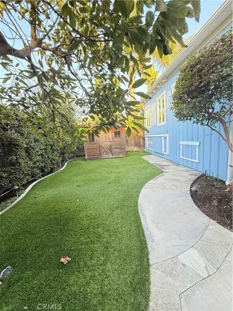 a house view with a garden space