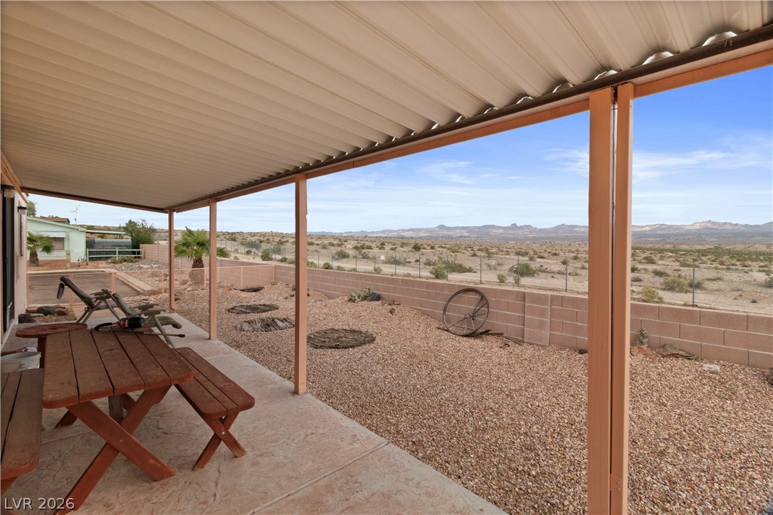 1609 Cajon Court Laughlin, NV 89029 - Photo 37 of 69 Fenced backyard with a patio area, a mountain view, a desert view, and a rural view