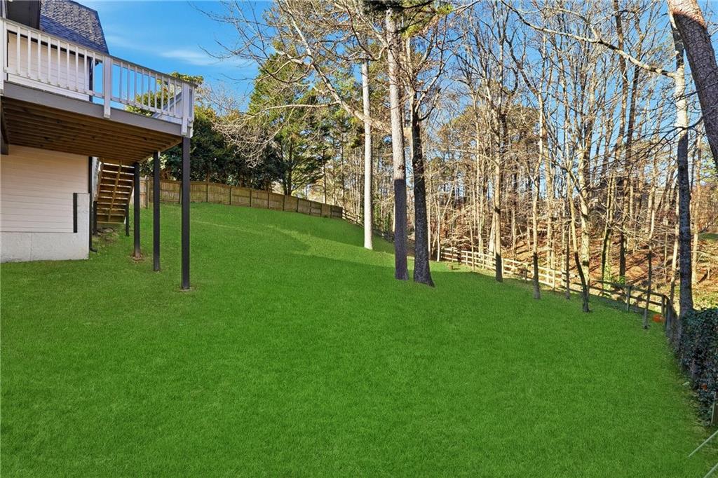 2152 Paces Vale Place Lawrenceville, GA 30043 - Photo 11 of 39 a view of a backyard with a garden