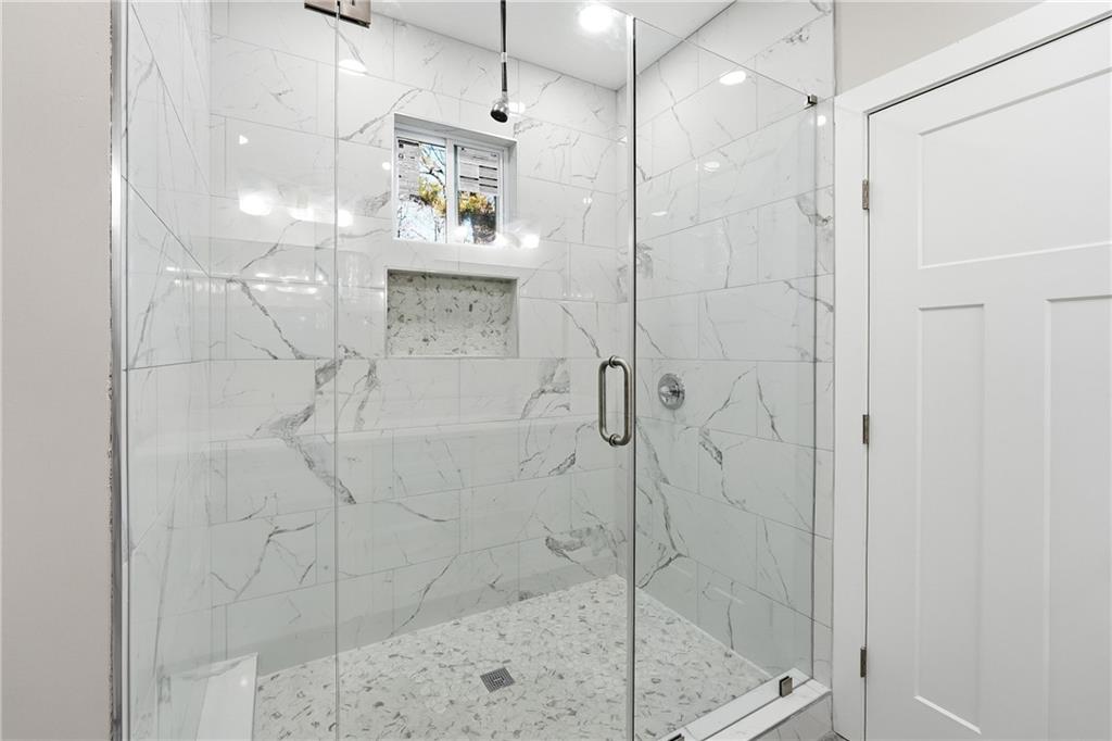 2152 Paces Vale Place Lawrenceville, GA 30043 - Photo 19 of 39 a bathroom with a shower