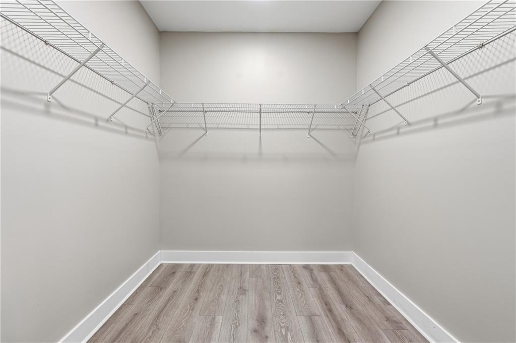 2152 Paces Vale Place Lawrenceville, GA 30043 - Photo 20 of 39 a view of a room with racks on the wall