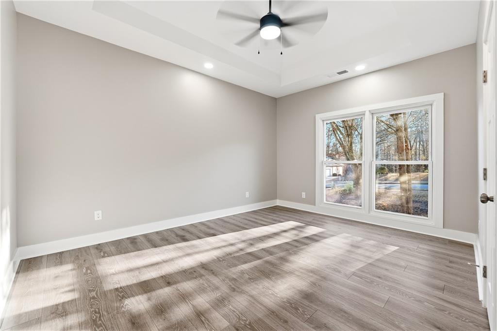 2152 Paces Vale Place Lawrenceville, GA 30043 - Photo 22 of 39 a view of an empty room with a window