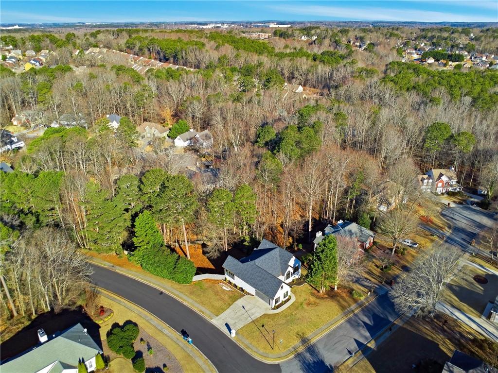 2152 Paces Vale Place Lawrenceville, GA 30043 - Photo 38 of 39 an aerial view of a house with a yard