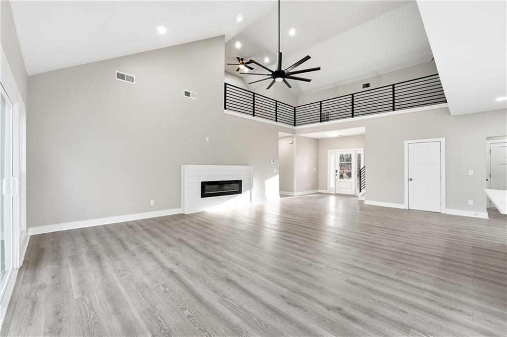2152 Paces Vale Place Lawrenceville, GA 30043 - Photo 10 of 39 wooden floor in an empty room with a window