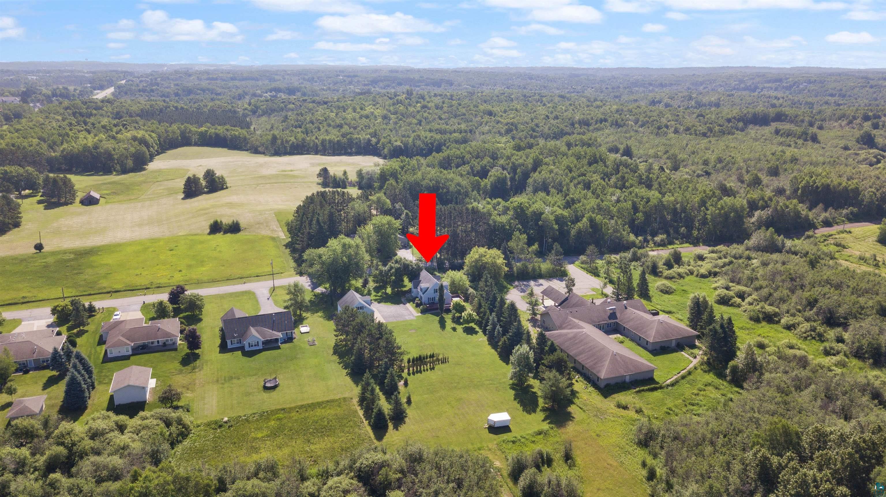 4073 Reinke Road Duluth, MN 55811 - Photo 27 of 32 Aerial perspective showcasing a residential property surrounded by expansive green spaces and mature trees