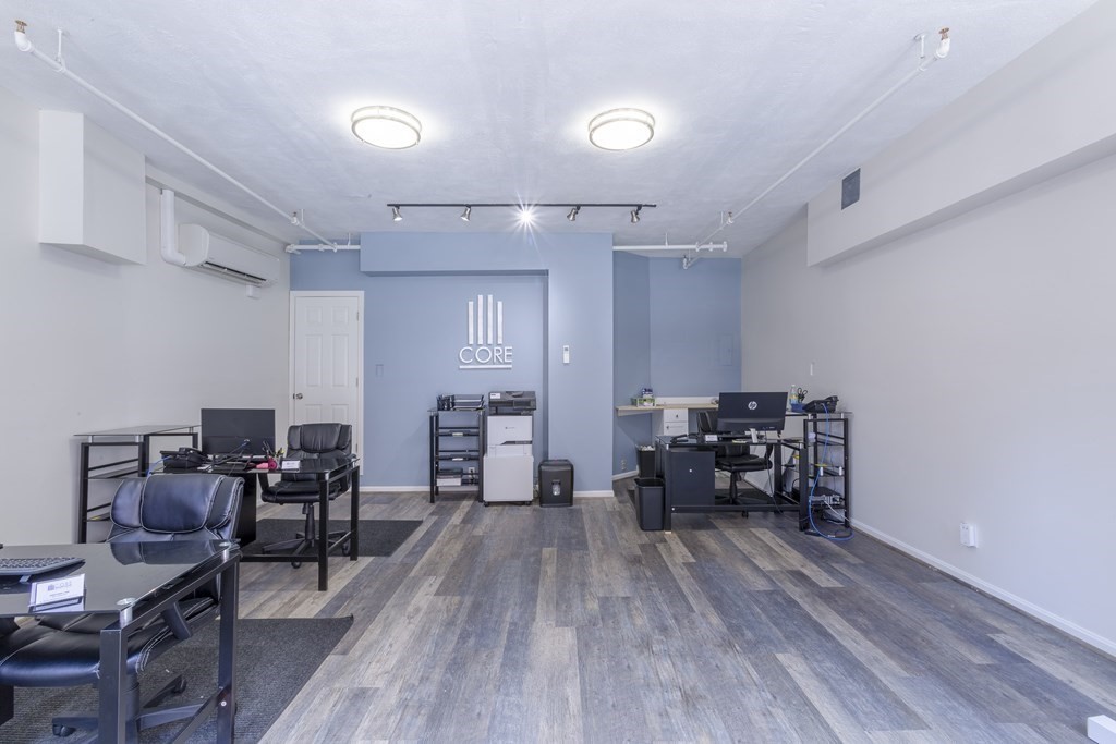 278 North Street, Unit 1 Boston, MA 02113 - Photo 2 of 5 a view of a workspace with furniture and wooden floor