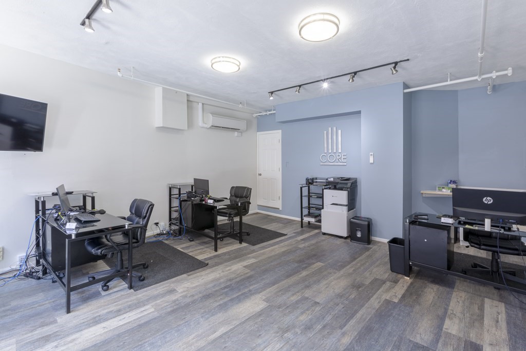 278 North Street, Unit 1 Boston, MA 02113 - Photo 3 of 5 a work room with furniture and wooden floor