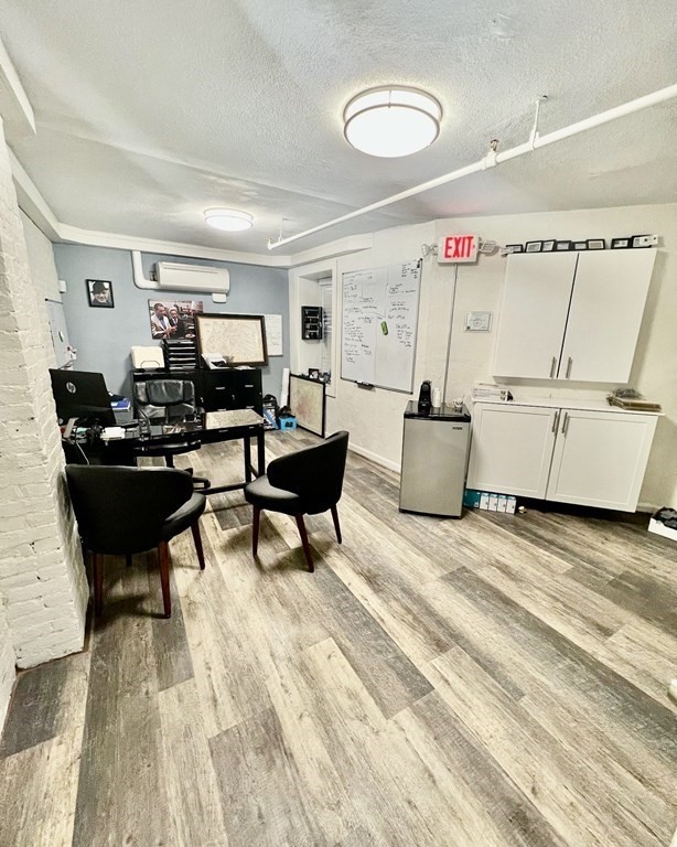 278 North Street, Unit 1 Boston, MA 02113 - Photo 5 of 5 a living room with furniture and a wooden floor