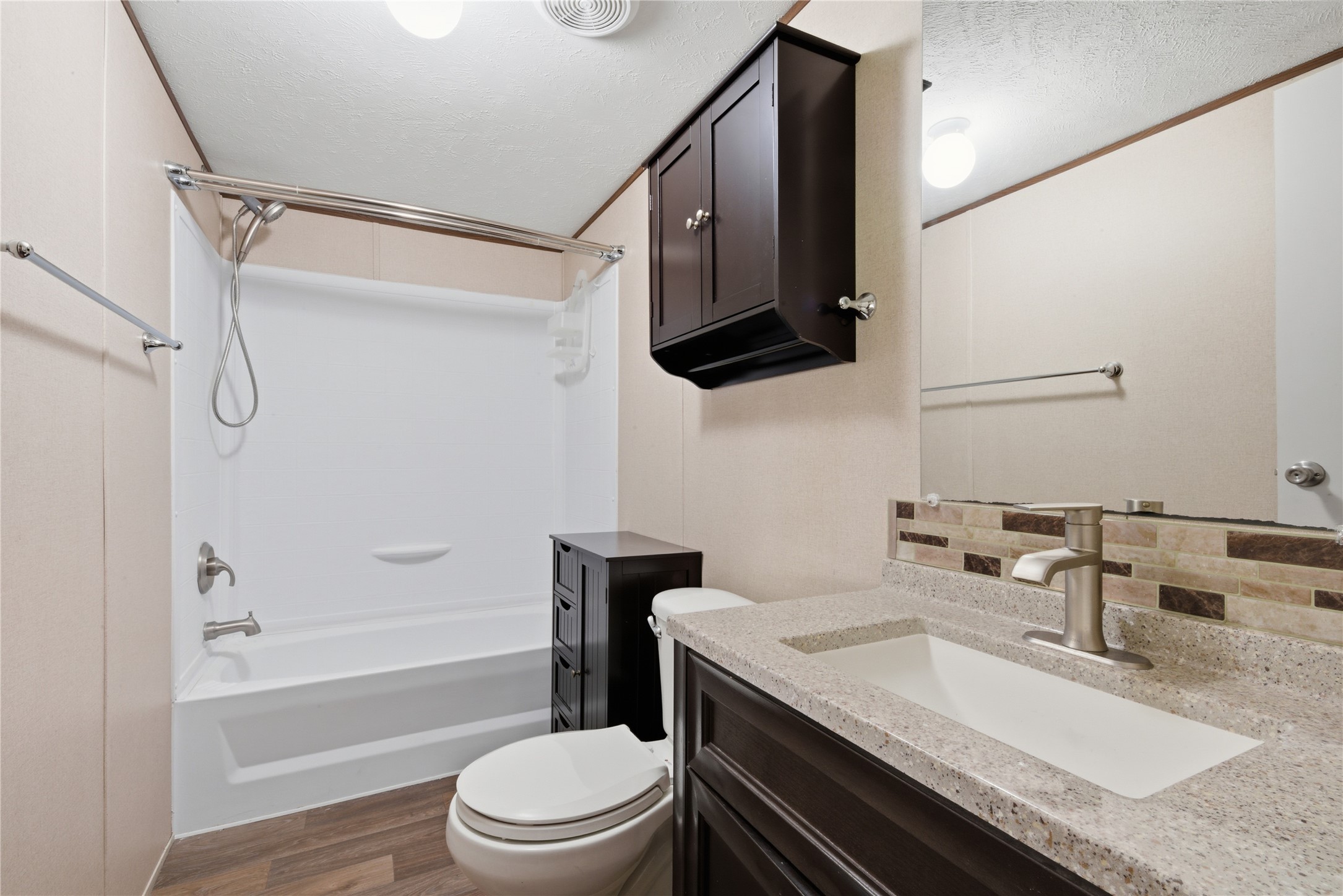 100 St Croix Drive Point Blank, TX 77364 - Photo 15 of 28 a bathroom with a granite countertop sink toilet a mirror and shower