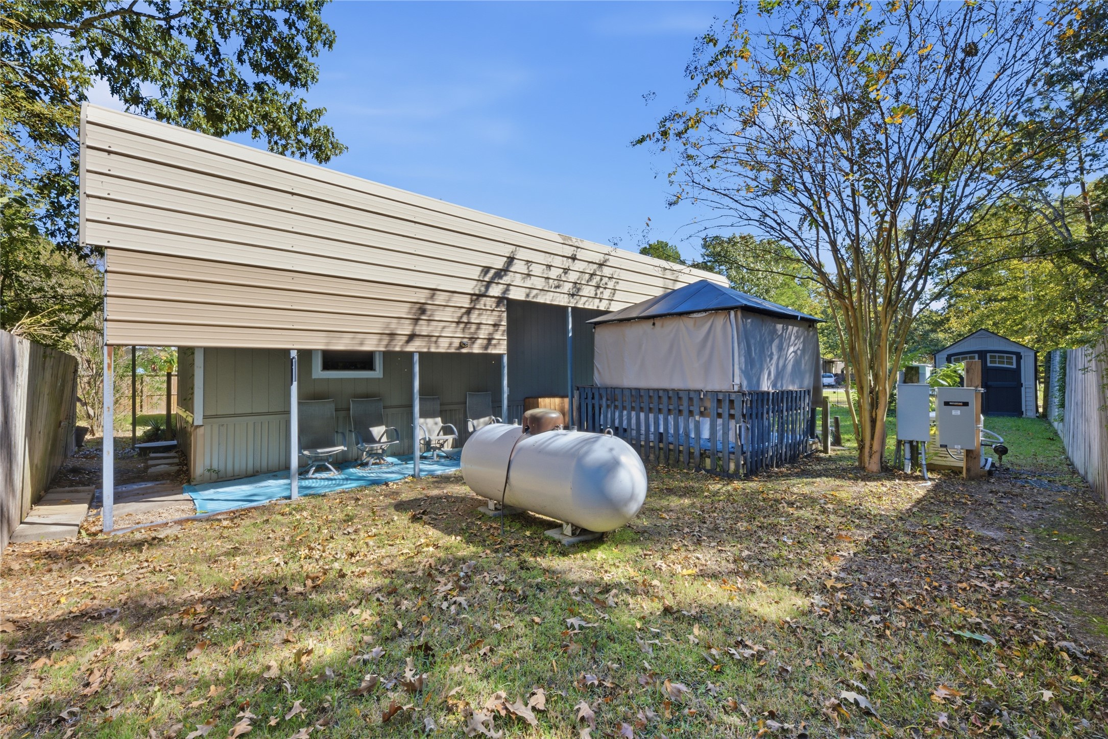 100 St Croix Drive Point Blank, TX 77364 - Photo 17 of 28 a view of a house with a backyard and wooden fence