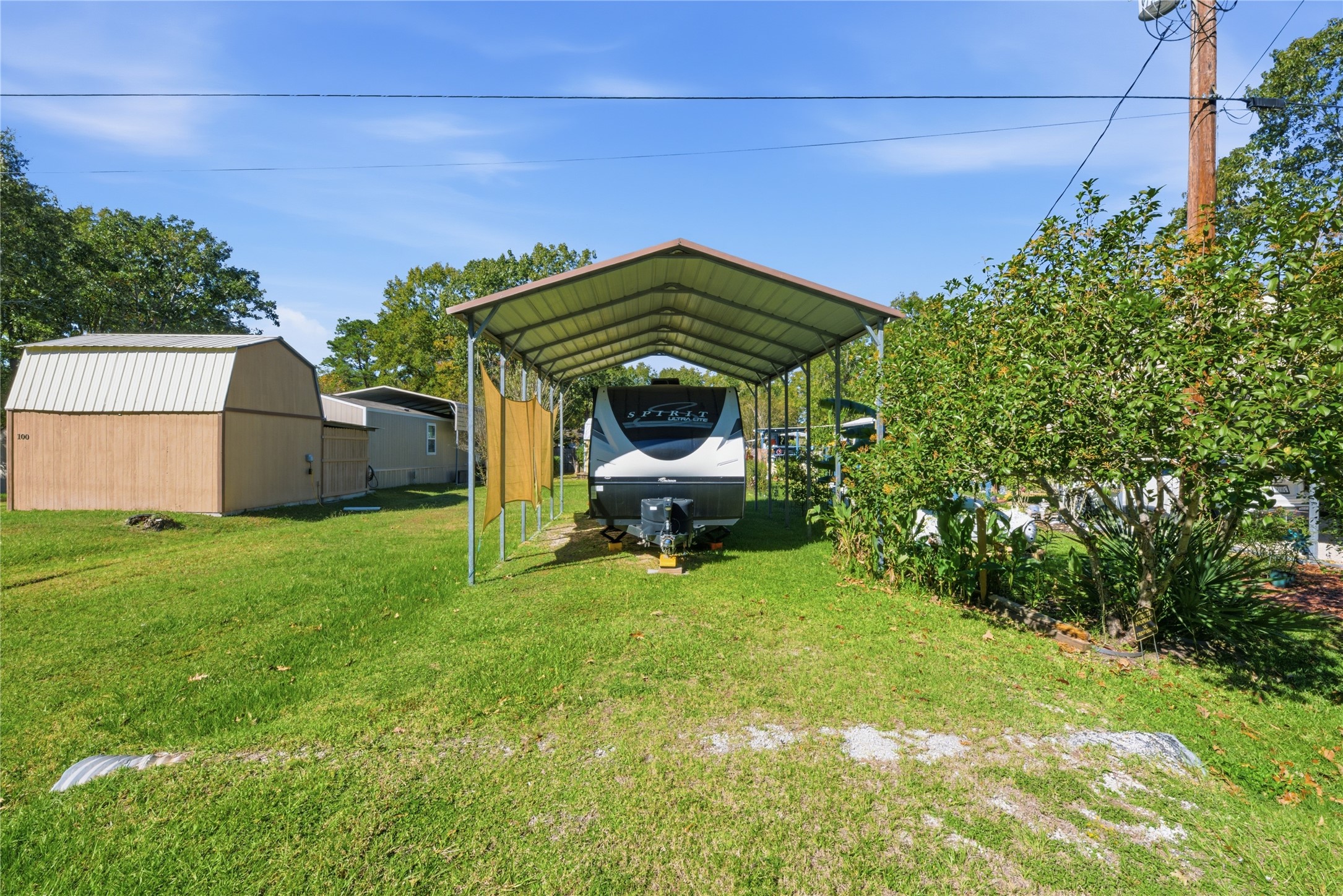 100 St Croix Drive Point Blank, TX 77364 - Photo 22 of 28 a view of a backyard with sitting area