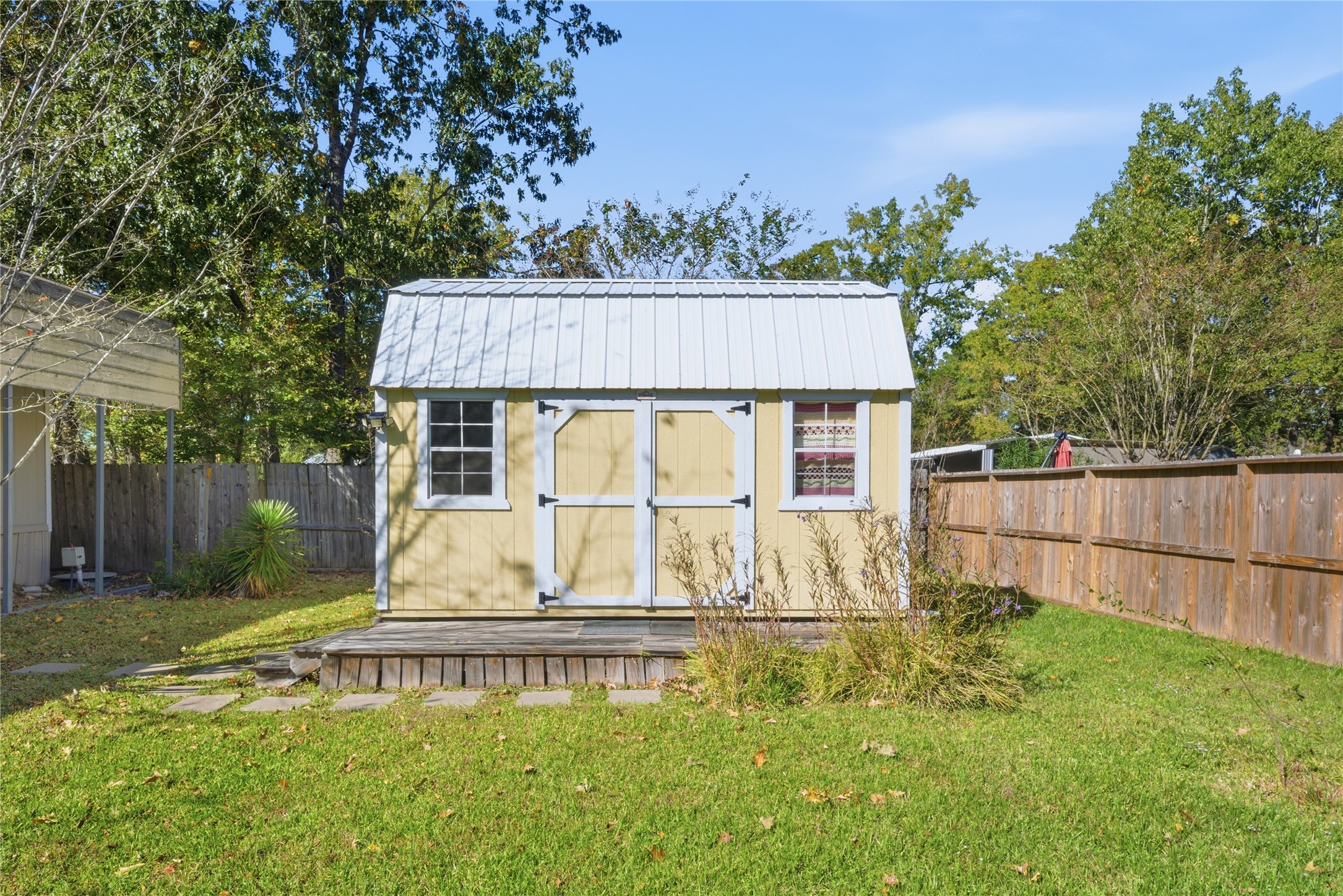 100 St Croix Drive Point Blank, TX 77364 - Photo 24 of 28 a view of a house with a yard plants and large tree