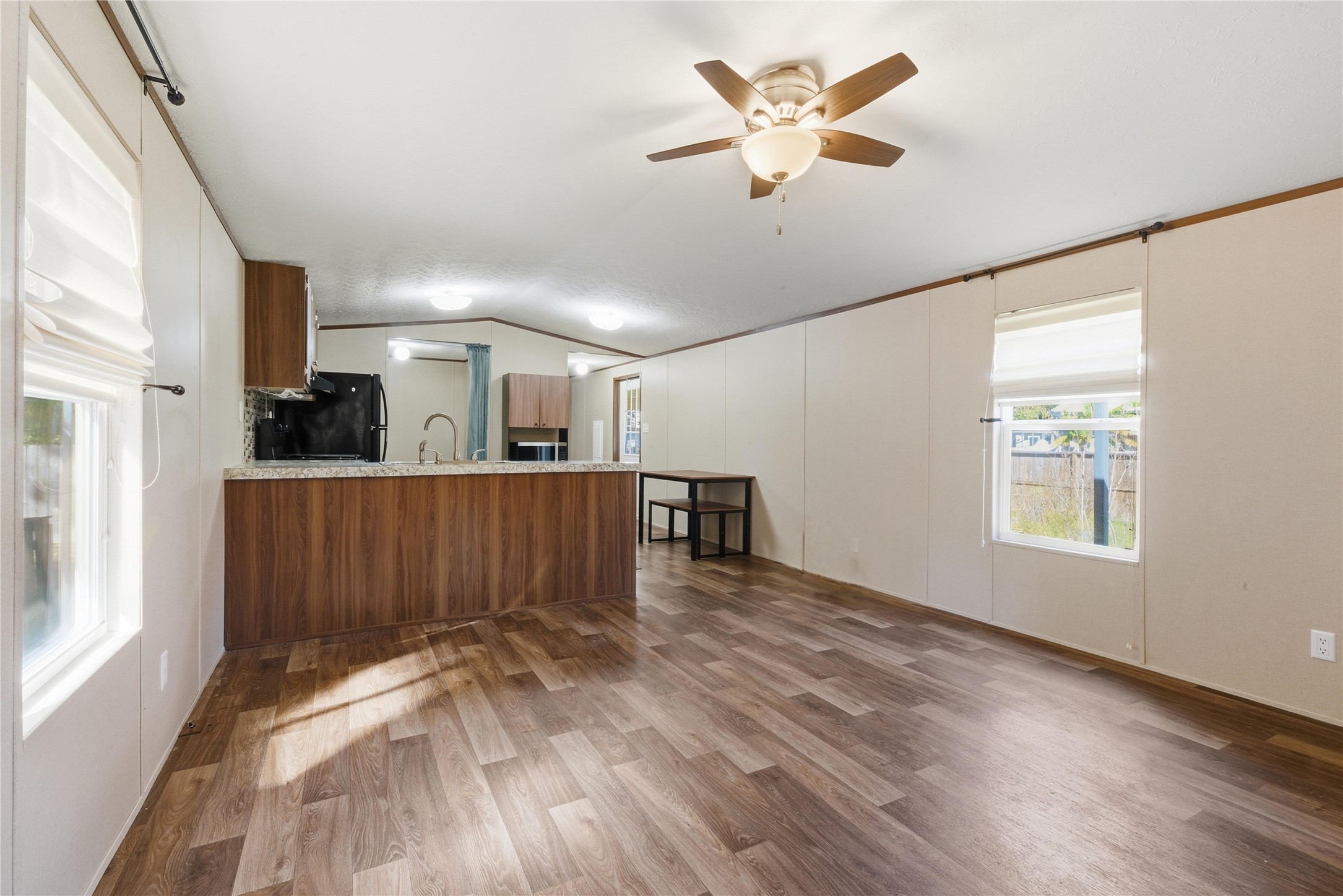 100 St Croix Drive Point Blank, TX 77364 - Photo 6 of 28 a view of a kitchen with furniture and a ceiling fan