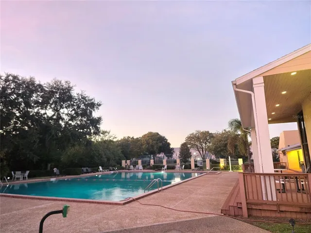 a view of a garden with a building in the background