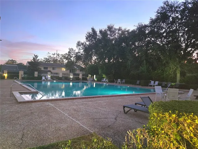 a view of a park with large trees