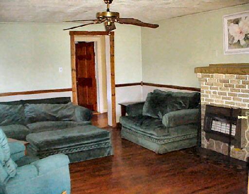544 Colonial Road Blue Ridge, VA 24064 - Photo 2 of 6 a living room with furniture and a fireplace