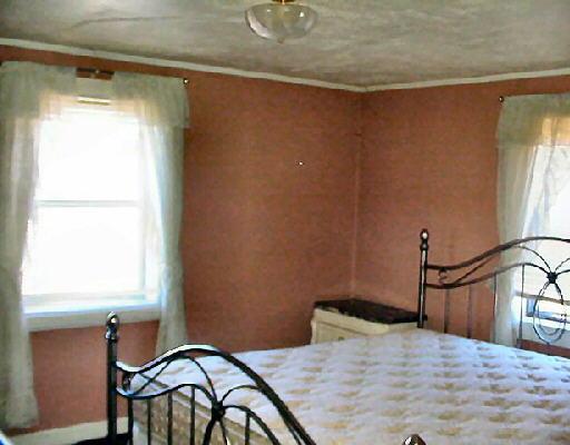 544 Colonial Road Blue Ridge, VA 24064 - Photo 4 of 6 a bedroom with a bed and a window