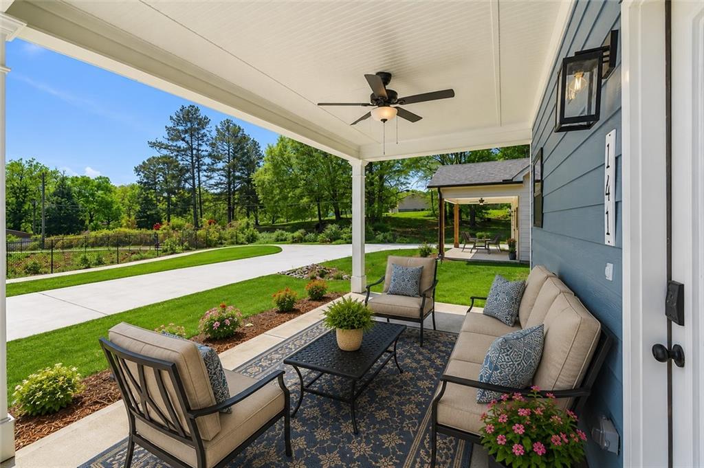 141 Old Alabama Road Southeast Emerson, GA 30137 - Photo 42 of 47 a view of a patio with couches chairs and a yard