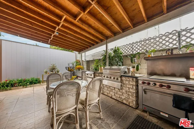 a view of a kitchen with a stove and a table