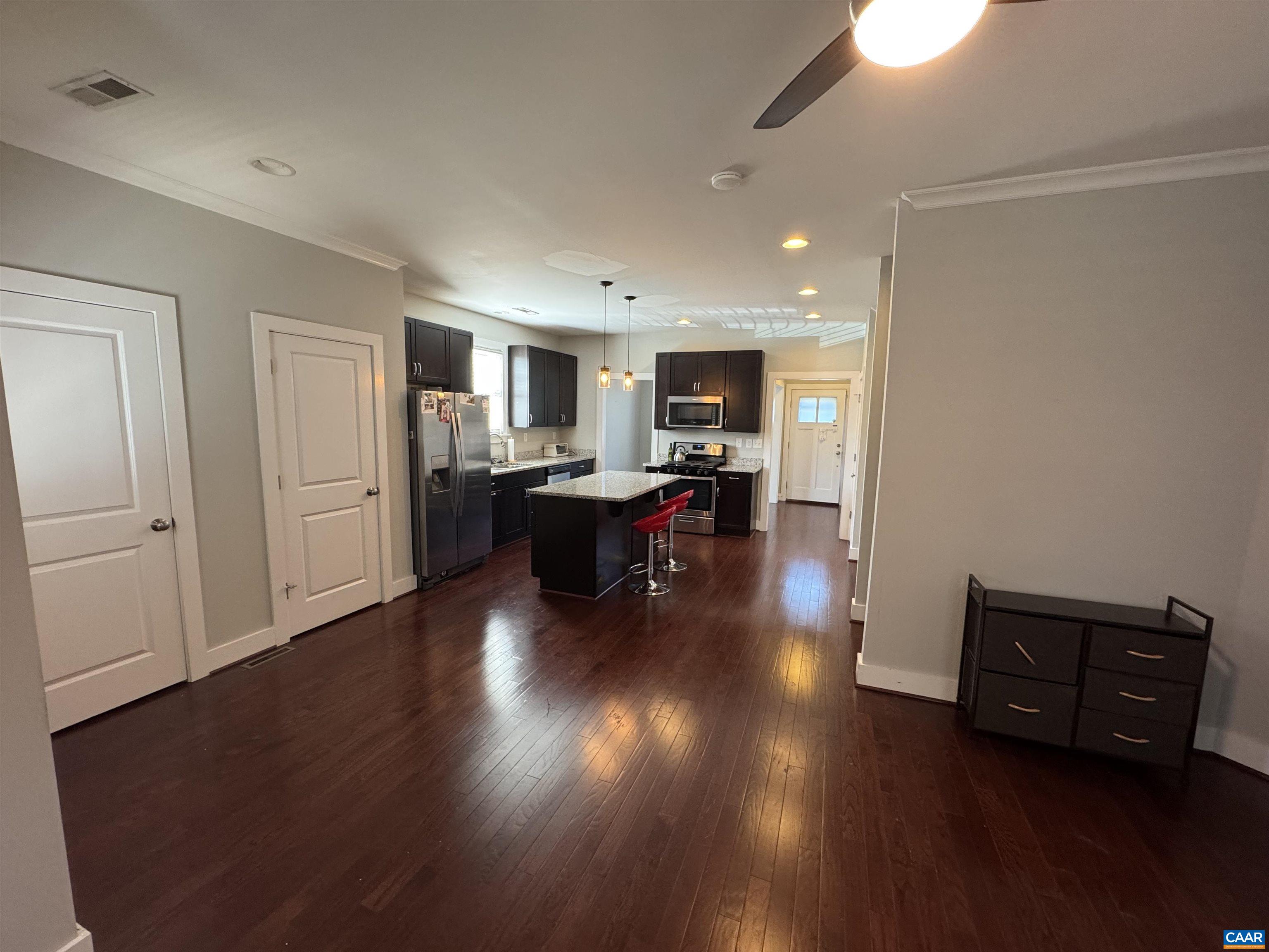 516 Rives Street Charlottesville, VA 22902 - Photo 11 of 26 a living room with furniture and a wooden floor