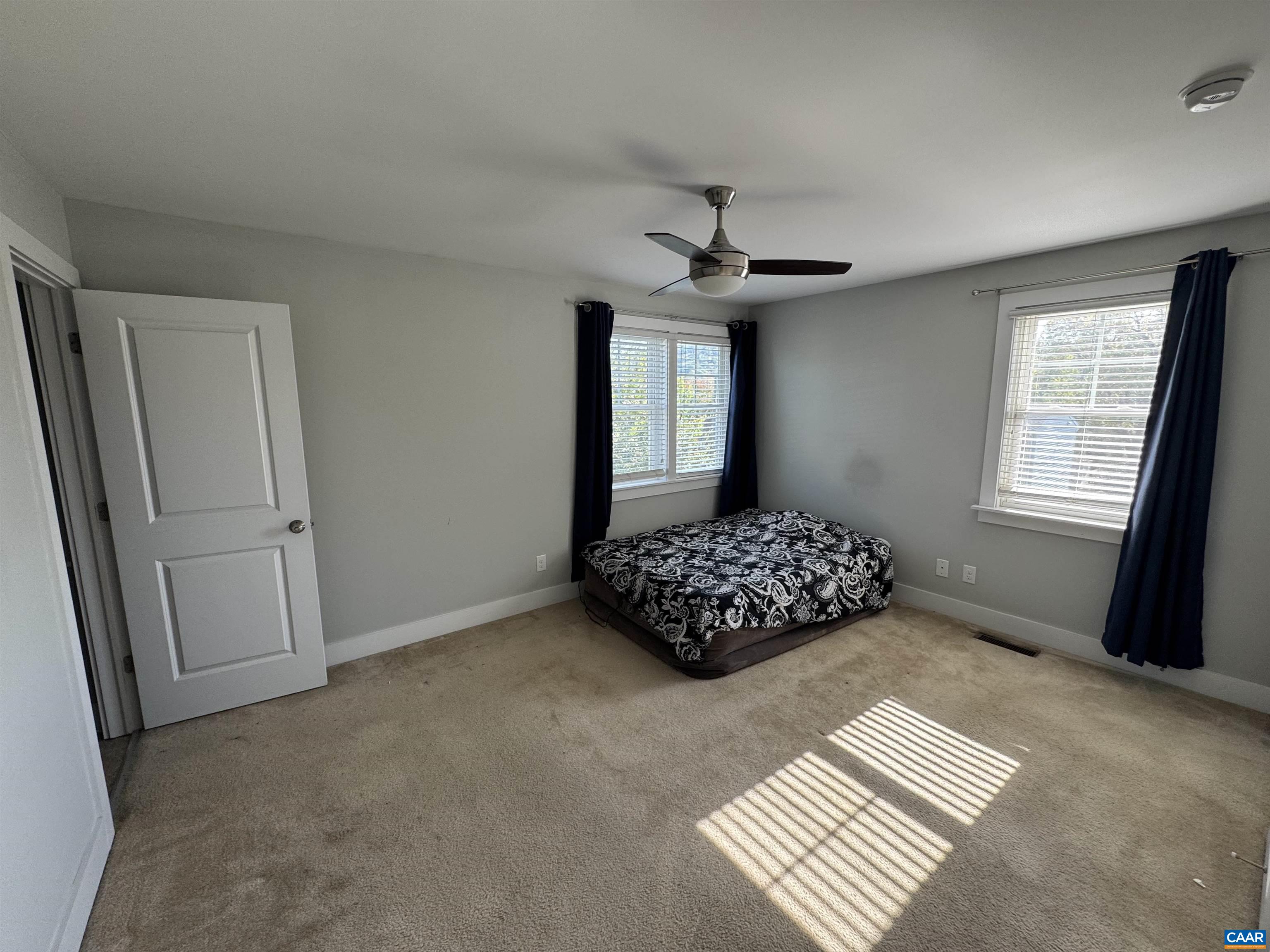 516 Rives Street Charlottesville, VA 22902 - Photo 19 of 26 a bedroom with a bed and a window