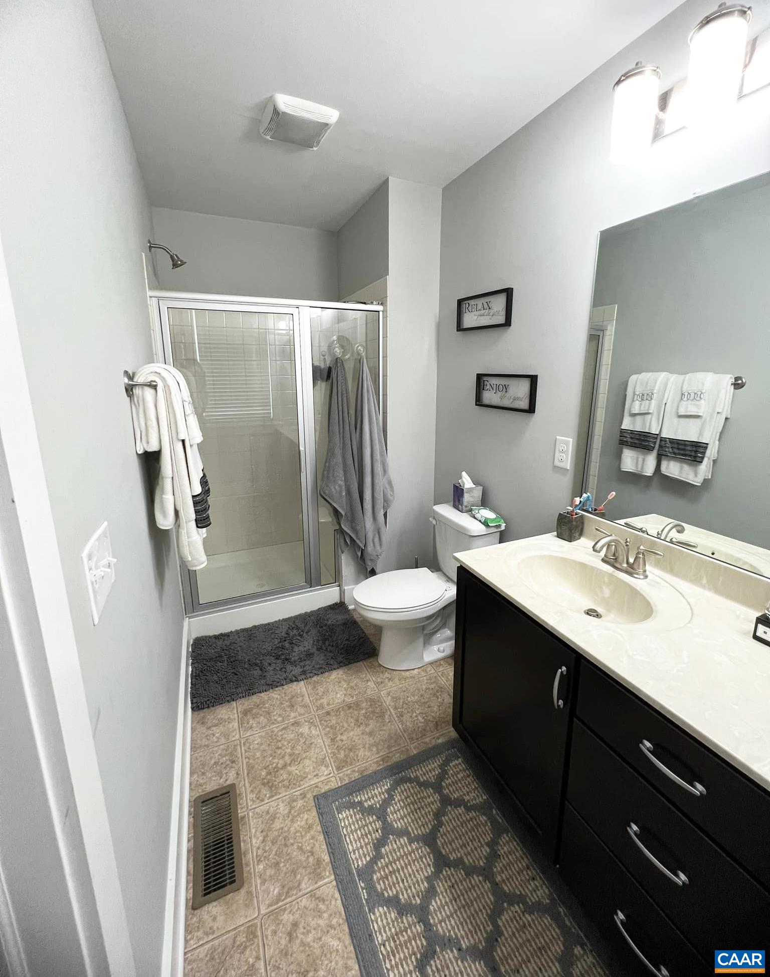 516 Rives Street Charlottesville, VA 22902 - Photo 21 of 26 a spacious bathroom with a double vanity sink toilet and shower