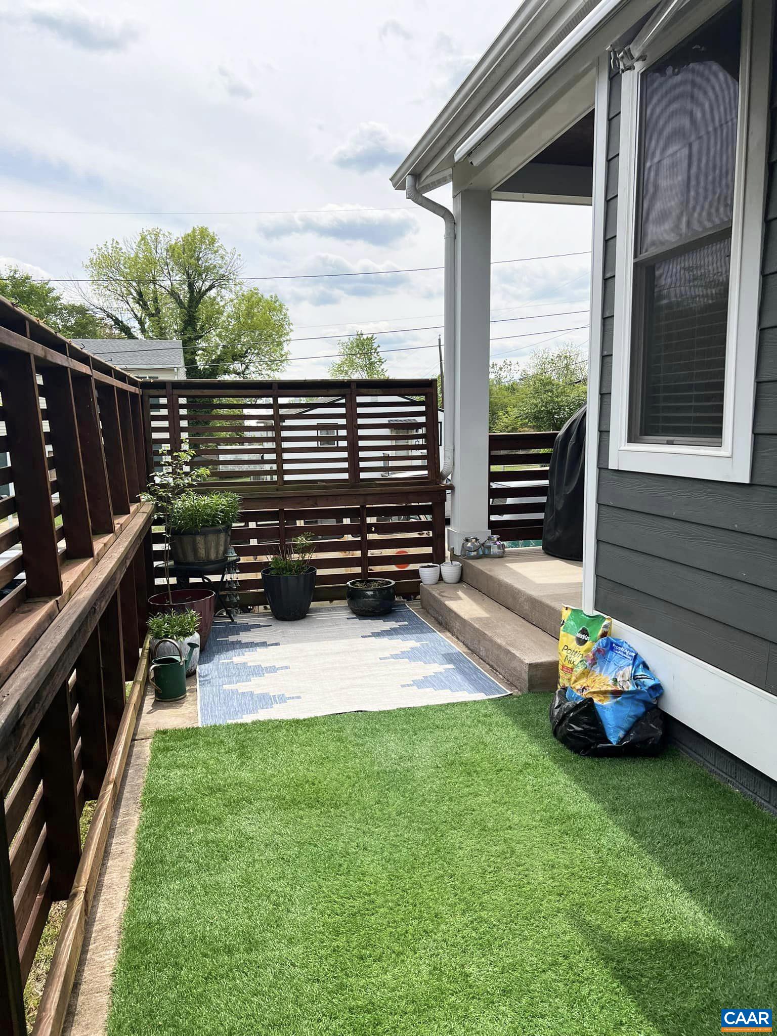 516 Rives Street Charlottesville, VA 22902 - Photo 26 of 26 a yellow and chair sitting in the grass