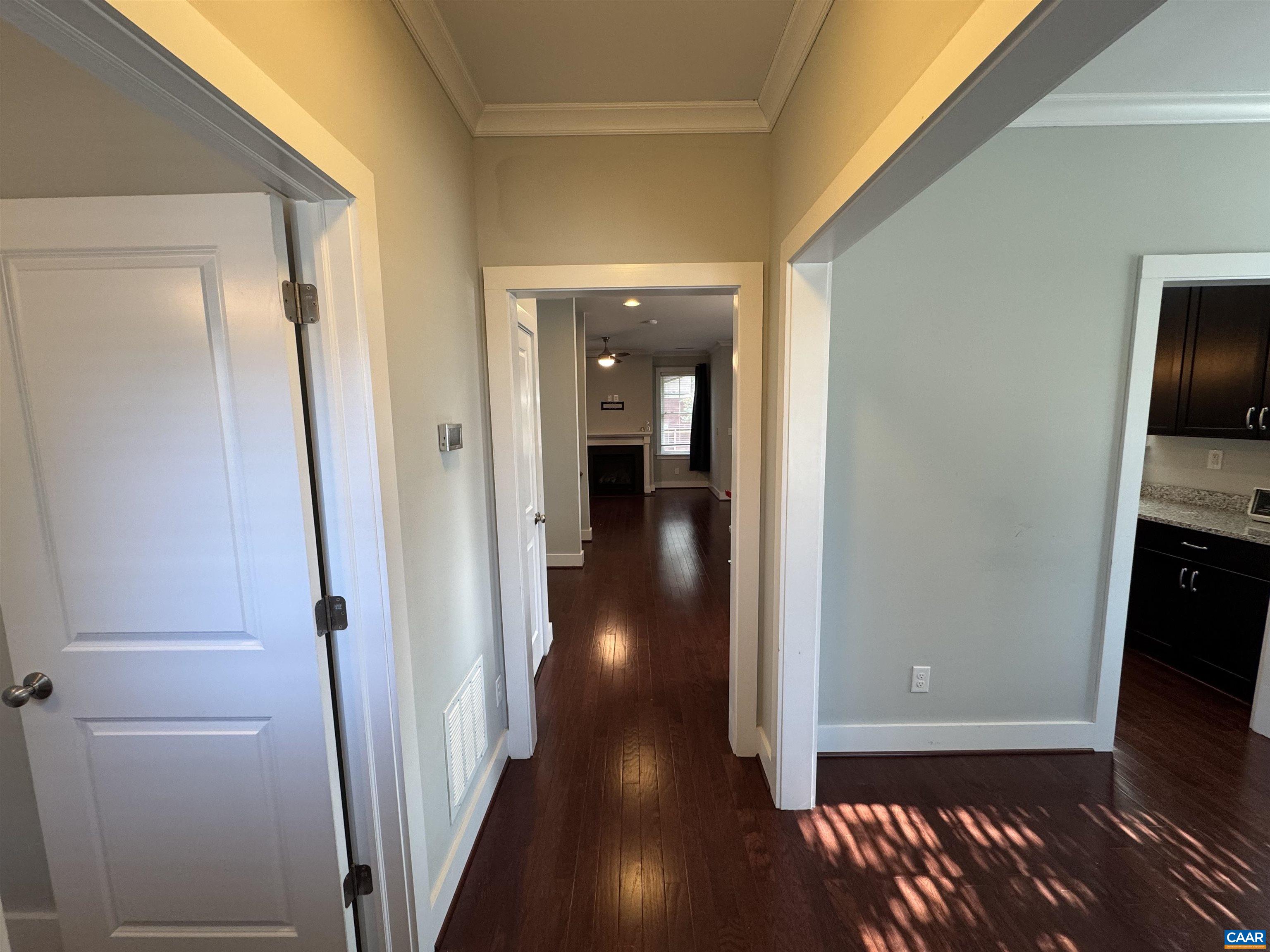 516 Rives Street Charlottesville, VA 22902 - Photo 4 of 26 a view of a hallway with wooden floor and staircase