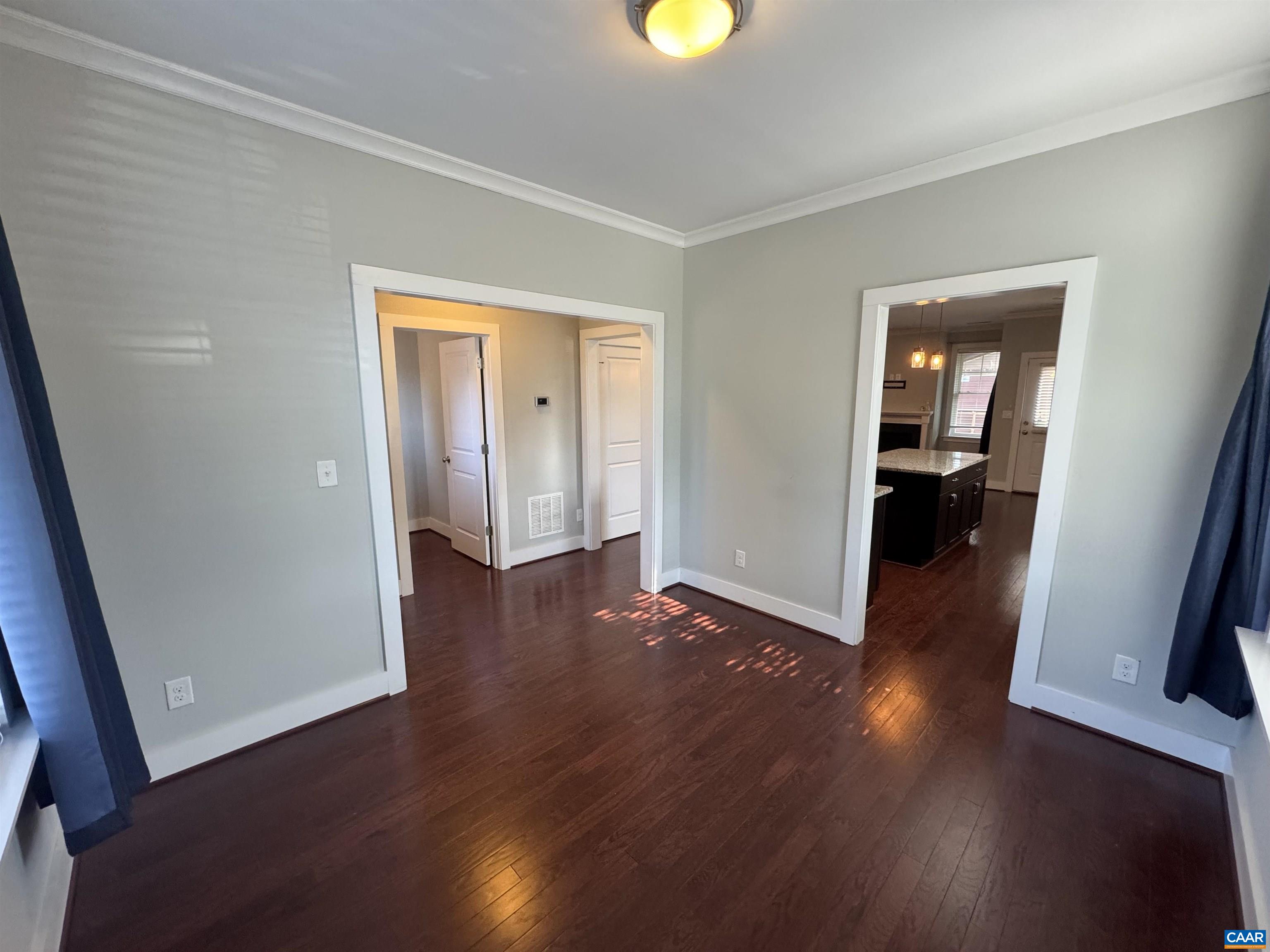 516 Rives Street Charlottesville, VA 22902 - Photo 6 of 26 an empty room with wooden floor and closet
