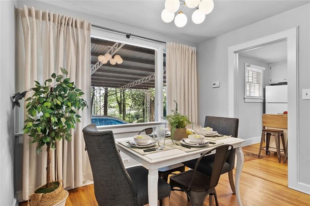 2218 East Street Covington, GA 30014 - Photo 13 of 38 a view of a dining room with furniture window and wooden floor