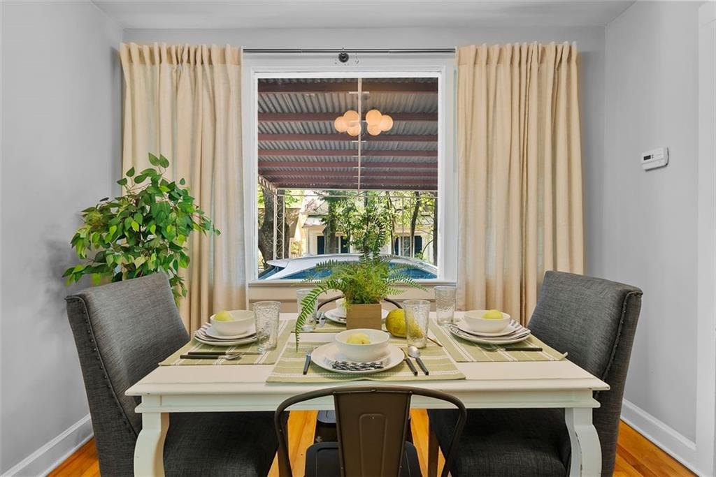 2218 East Street Covington, GA 30014 - Photo 14 of 38 a view of a dining room with furniture window and wooden floor