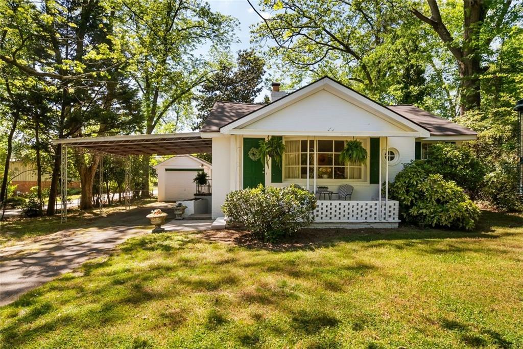 2218 East Street Covington, GA 30014 - Photo 2 of 38 a front view of a house with a yard