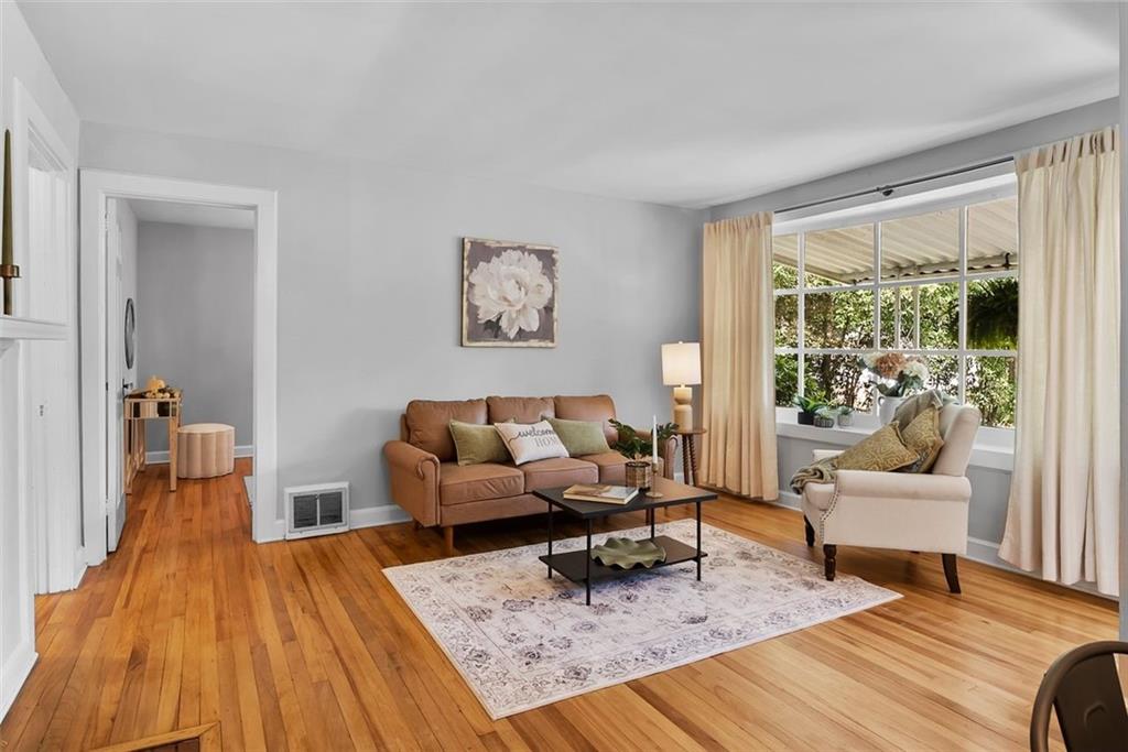 2218 East Street Covington, GA 30014 - Photo 22 of 38 a living room with furniture and a rug