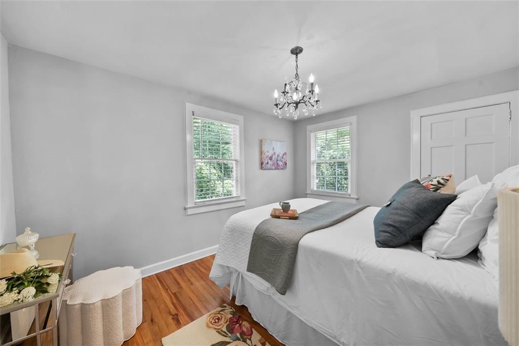 2218 East Street Covington, GA 30014 - Photo 23 of 38 a bedroom with a bed and a chandelier