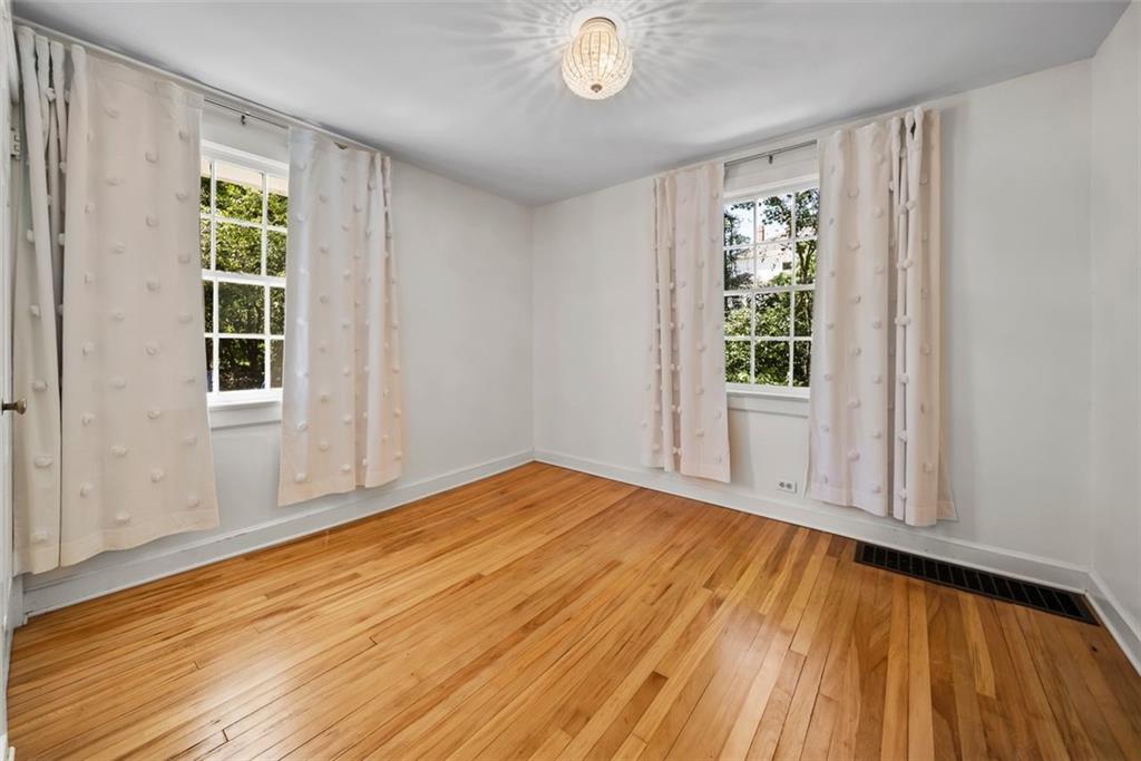 2218 East Street Covington, GA 30014 - Photo 25 of 38 a view of empty room with wooden floor and fan
