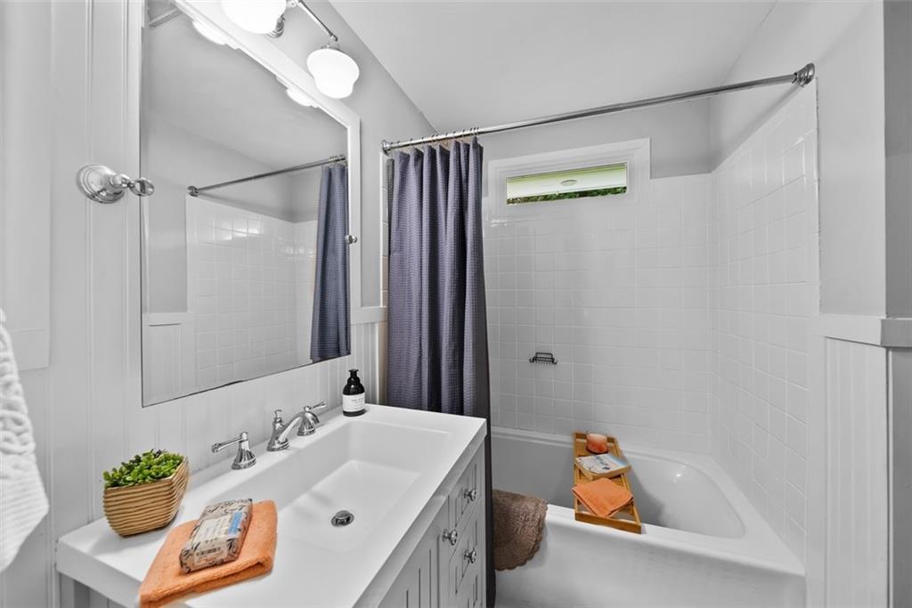 2218 East Street Covington, GA 30014 - Photo 28 of 38 a bathroom with a sink and a mirror