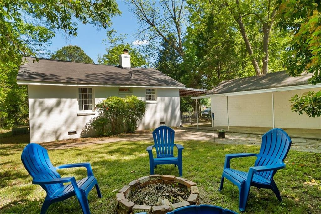 2218 East Street Covington, GA 30014 - Photo 32 of 38 a backyard of a house with table and chairs