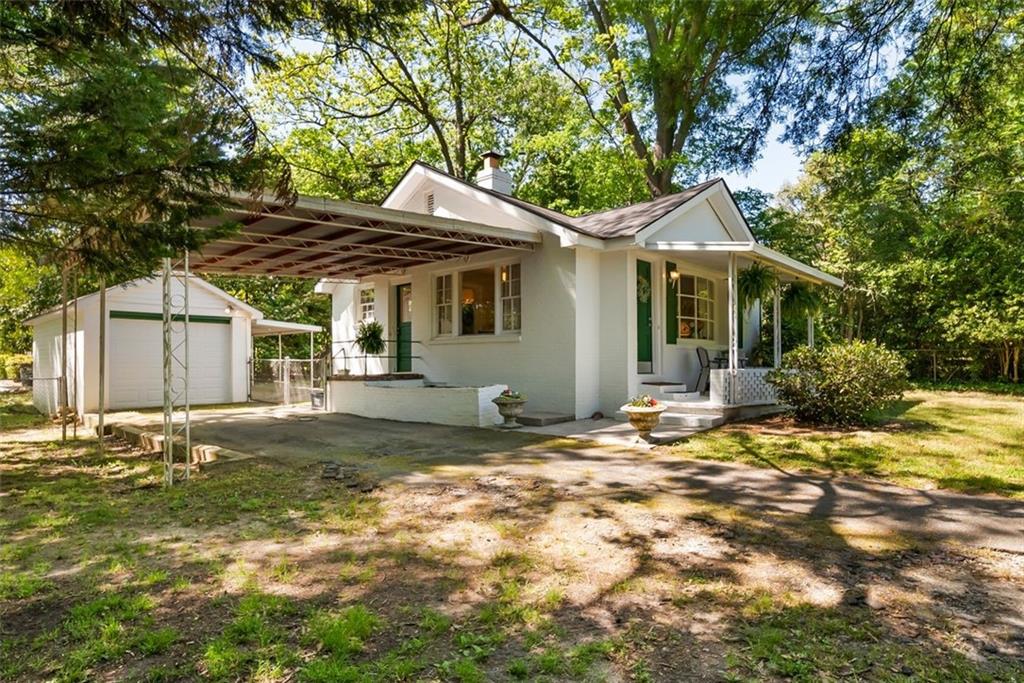 2218 East Street Covington, GA 30014 - Photo 34 of 38 a view of a yard in front of a house with large tree