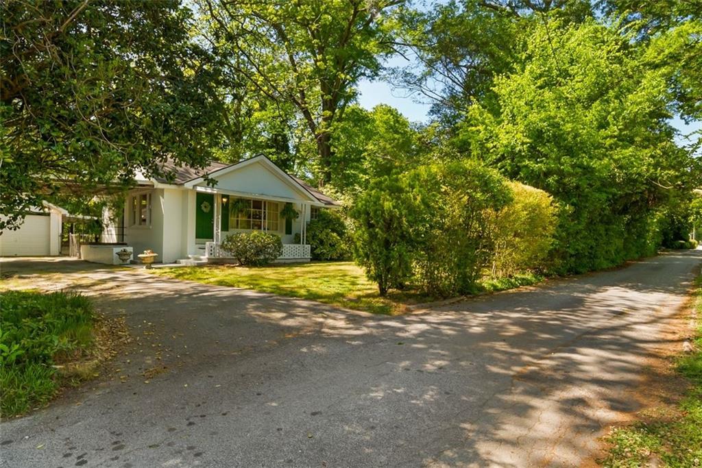 2218 East Street Covington, GA 30014 - Photo 36 of 38 a view of a house with a large tree and a yard