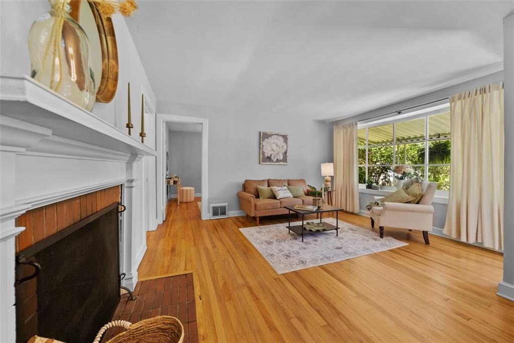 2218 East Street Covington, GA 30014 - Photo 9 of 38 a bedroom with a bed and wooden floor