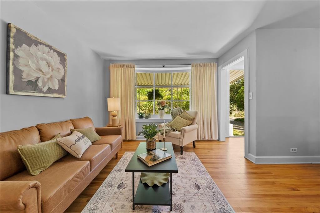 2218 East Street Covington, GA 30014 - Photo 10 of 38 a living room with furniture and a large window