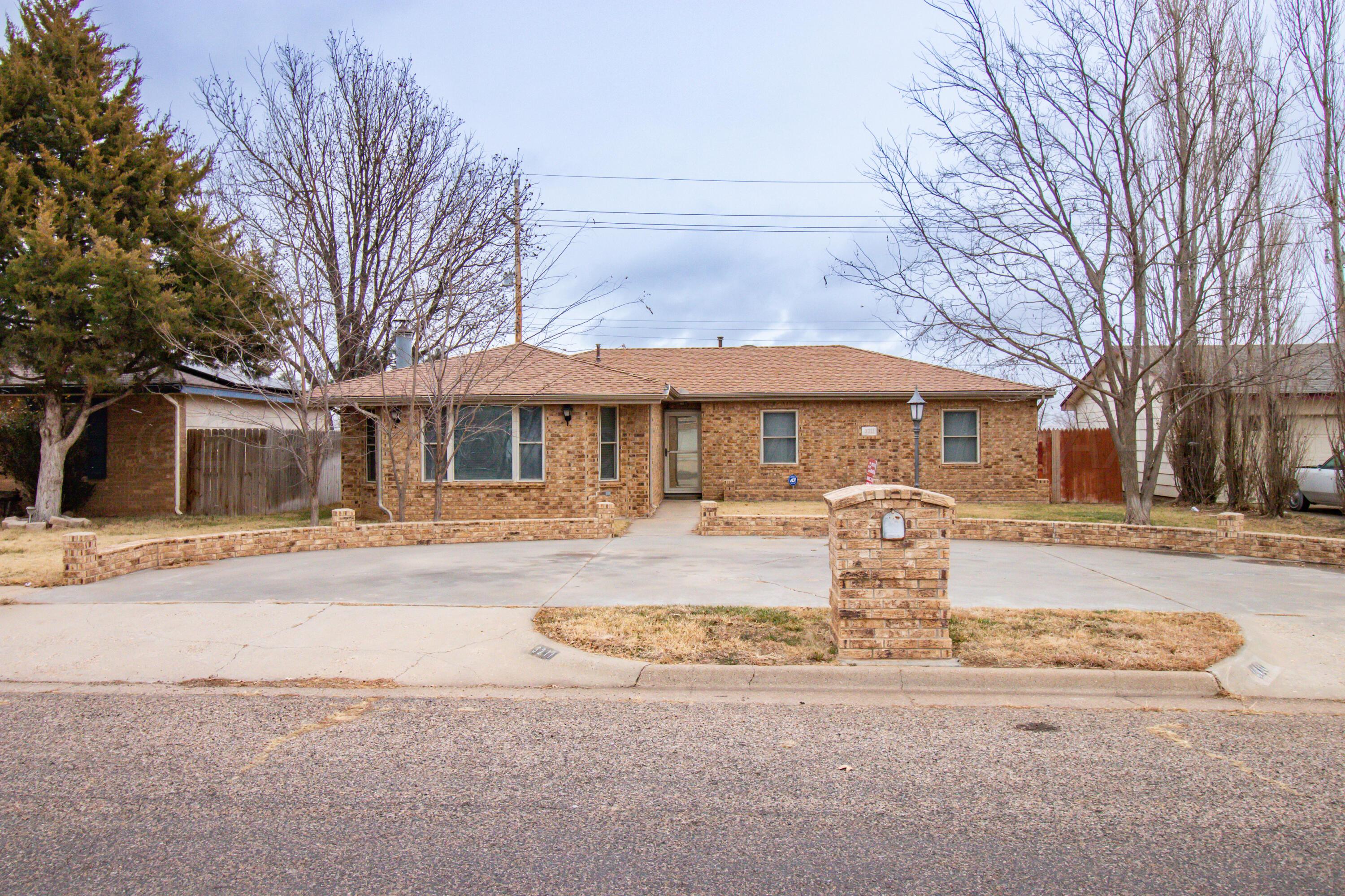 3211 Hodges Street Amarillo, TX 79103 - Photo 2 of 32 a front view of a house with a yard