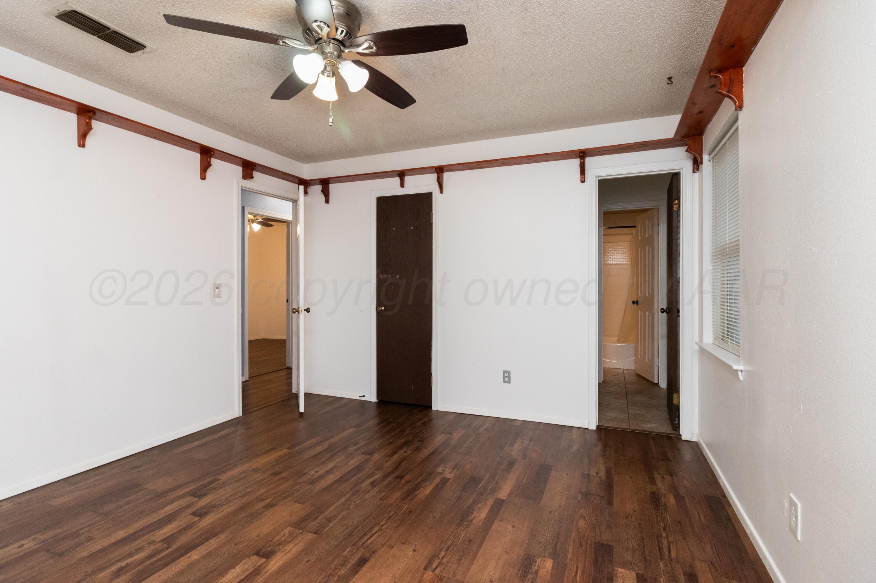 3211 Hodges Street Amarillo, TX 79103 - Photo 24 of 32 wooden floor in an empty room