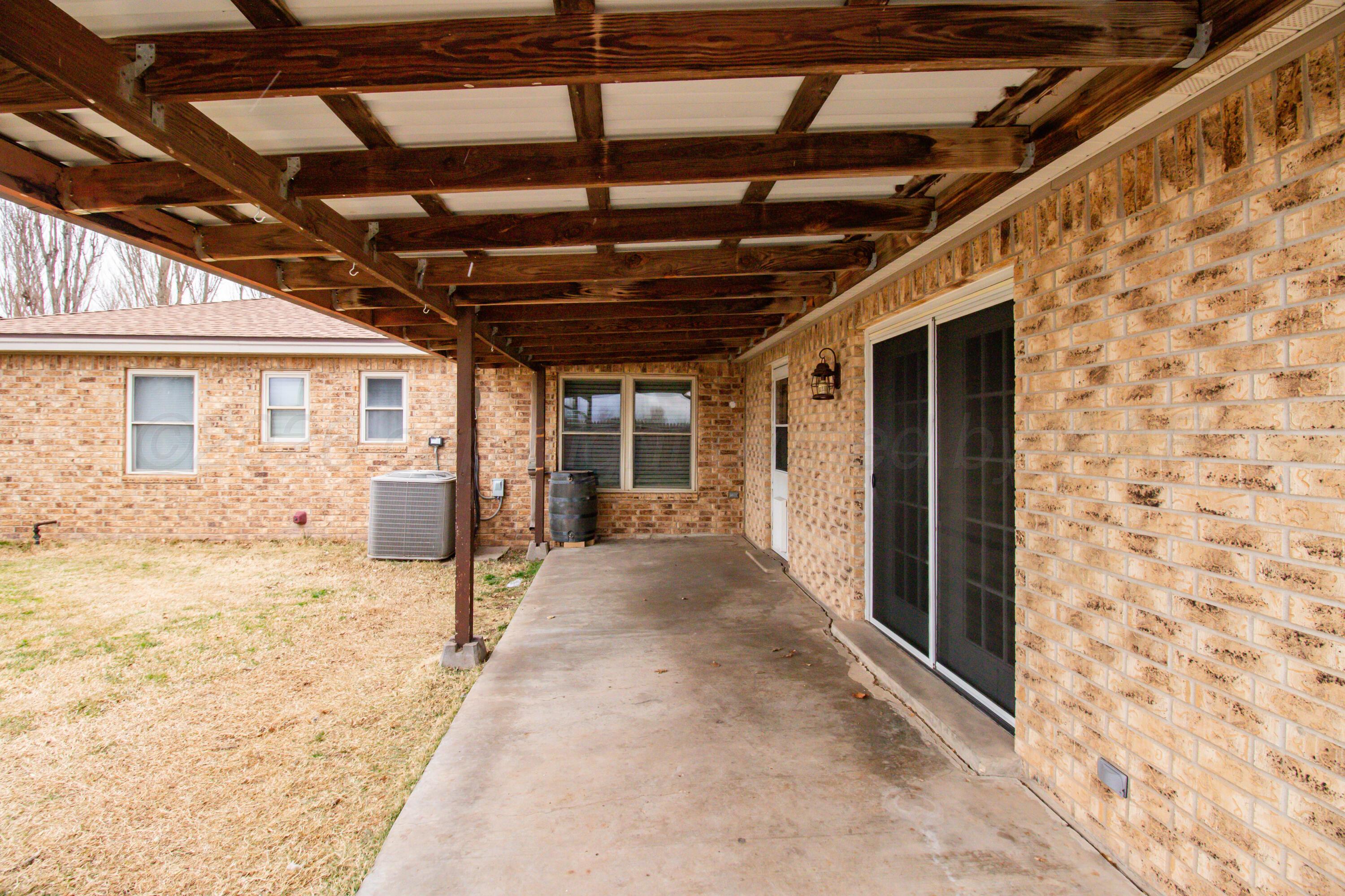 3211 Hodges Street Amarillo, TX 79103 - Photo 29 of 32 a view of a hall with wooden floor