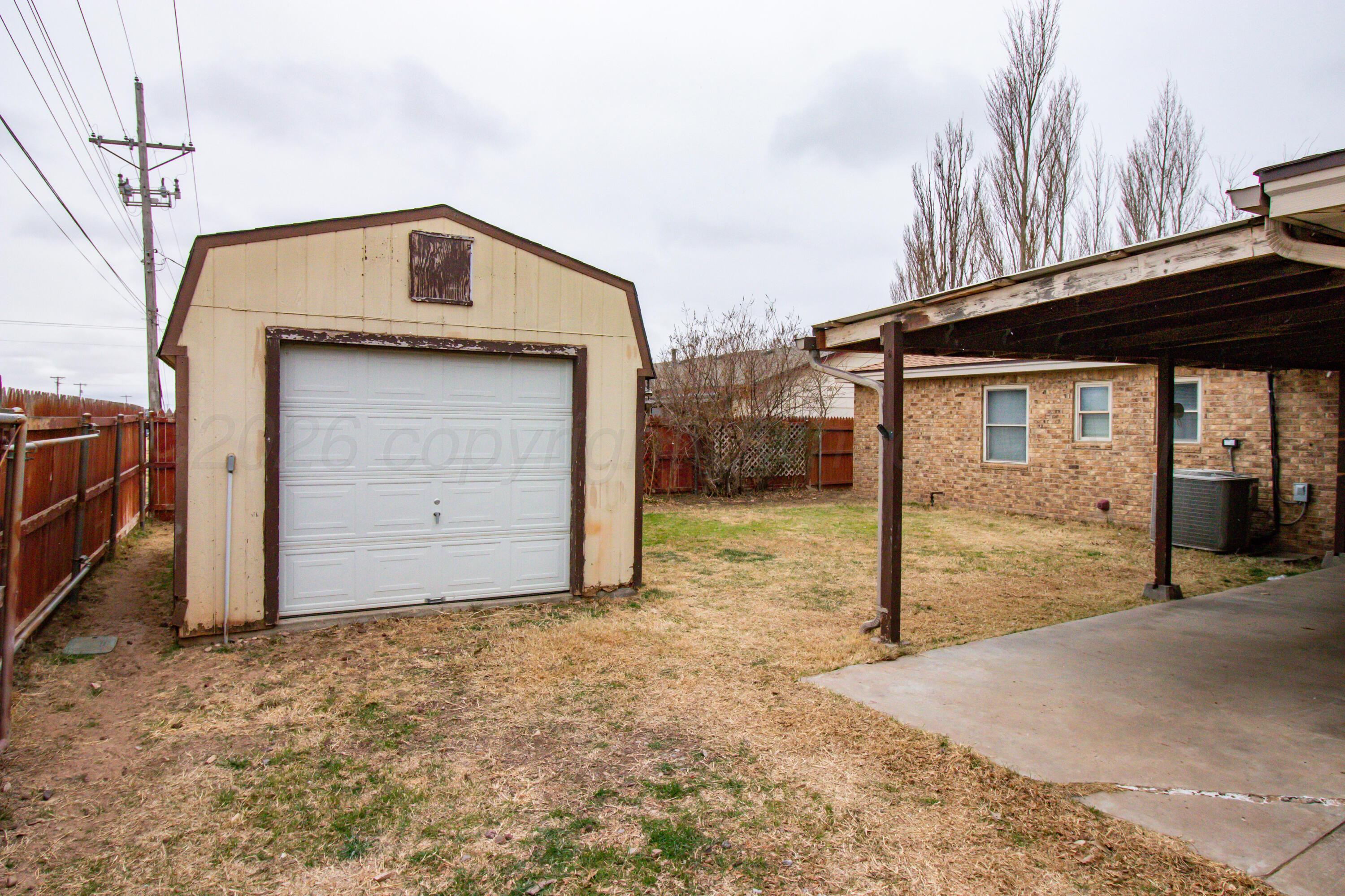 3211 Hodges Street Amarillo, TX 79103 - Photo 30 of 32 a view of a house with a garage