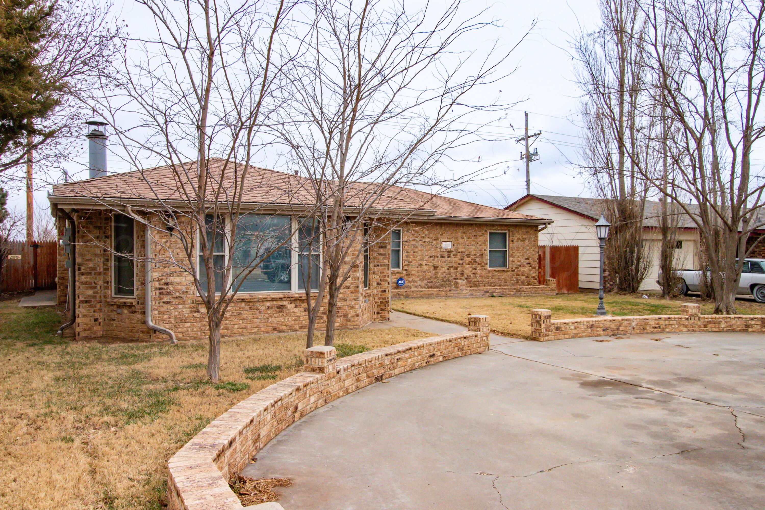 3211 Hodges Street Amarillo, TX 79103 - Photo 3 of 32 a house with trees in the background
