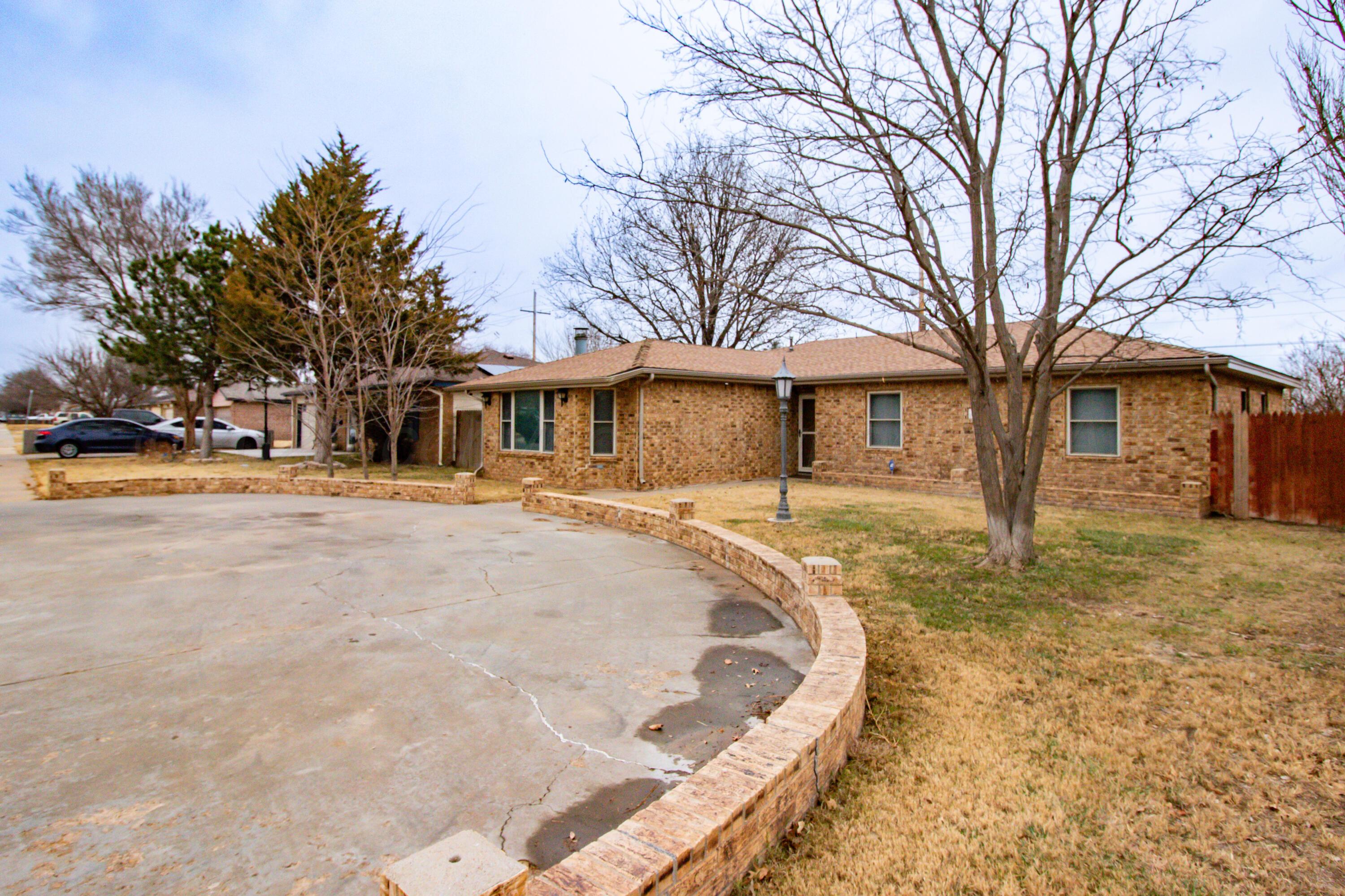 3211 Hodges Street Amarillo, TX 79103 - Photo 4 of 32 a house with trees in the background